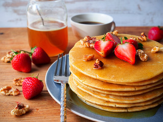 Pancakes with strawberry,walnut and honey for healthy breakfast