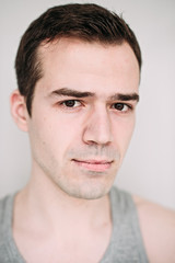 Obraz premium Close up portrait of a handsome young man on white