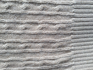 Close-up photo of knitted crumpled textured surface background