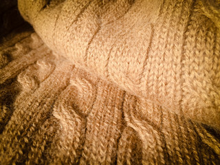 Close-up photo of knitted crumpled textured surface background
