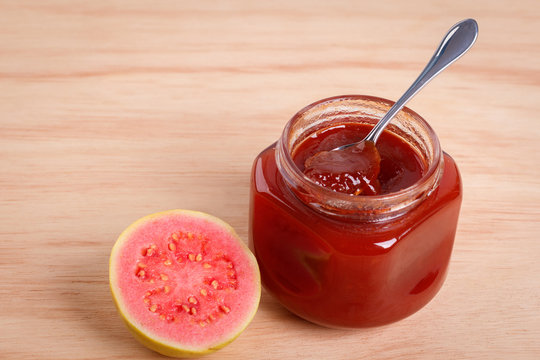 Brazilian dessert goiabada - jam of guava with fresh goiaba on wooden background. Selective focus. Copy space