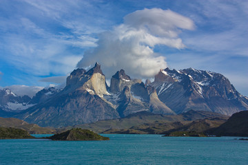 view of beautiful clouds over Cuernos del Paine and the lake Pehoe in national park of Torres del Paine in Chile