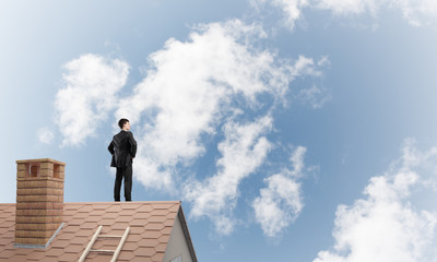 Mister boss on brick roof with arms akimbo. Mixed media