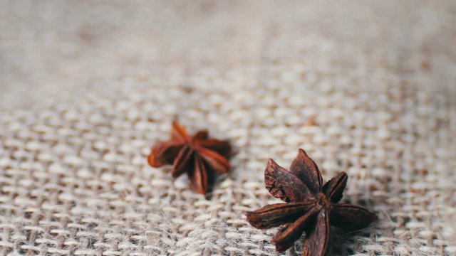 Cinnamon rods and star anise on the old cloth