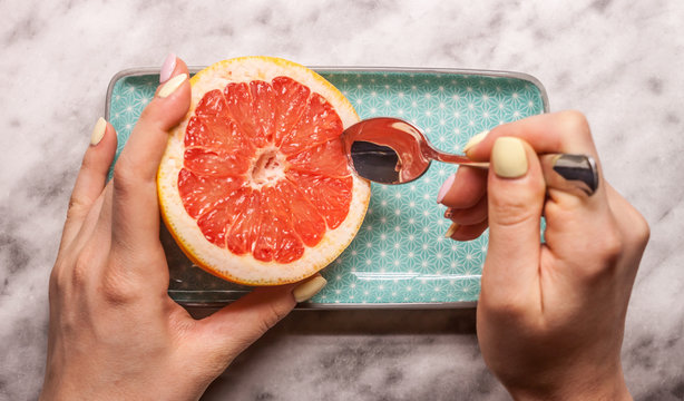 red grapefruit rectangular plate and spoon
