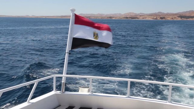 egyptian flag on the white yacht sway on the wind