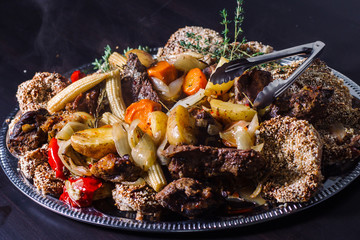 Grilled meat with boiled potatoes and vegetables