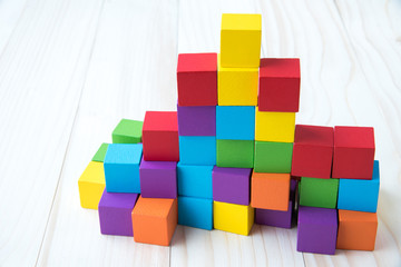 Colorful stack of wood cube building blocks