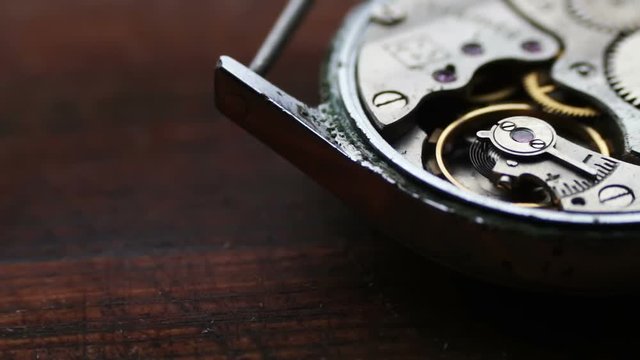 Old Stopwatch Mechanism On a stylish wooden background