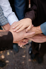 At the wedding Keep the groom's friends' hands, support, confidence, purpose, unity. hold their hands