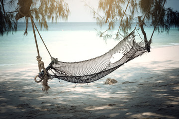 The cradle under tree beside the beach