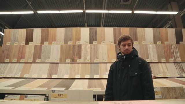 Man chooses products in the build supermarket.