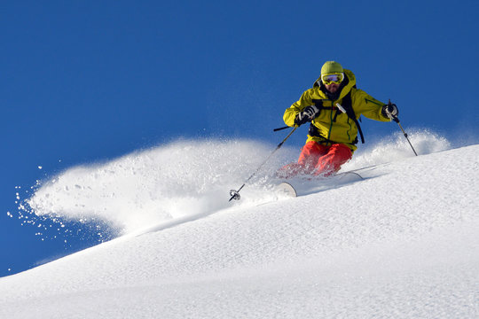Man skiing on snowy mountain landscape