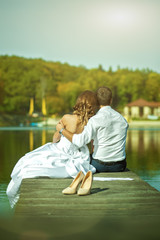 Fototapeta premium newlyweds on a bridge near the Lake