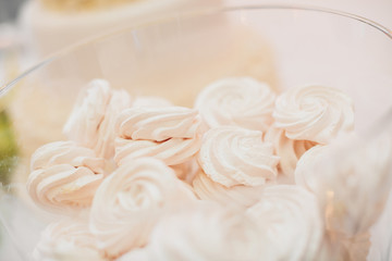 cakes in vase on buffet. candy bar