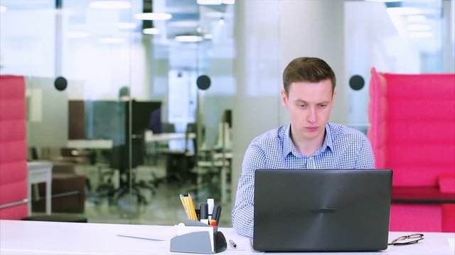 Positive office workers unsuccessfully joking with a tired colleague