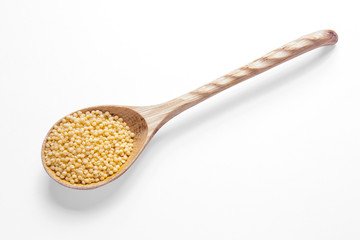 Millet on wooden spoons.