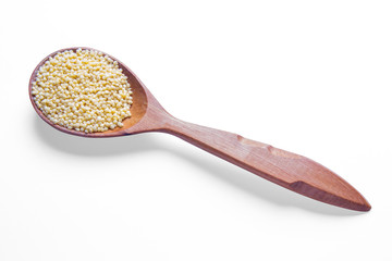 Millet on wooden spoons.