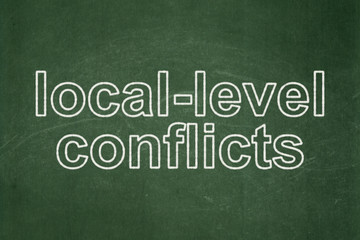 Fototapeta premium Politics concept: Local-level Conflicts on chalkboard background