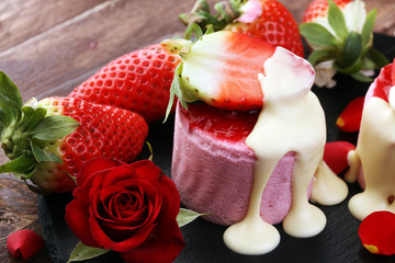 Delicious cupcake for Valentine Day. cake for Valentines day with chocolate and strawberries. Traditional homemade with red roses
