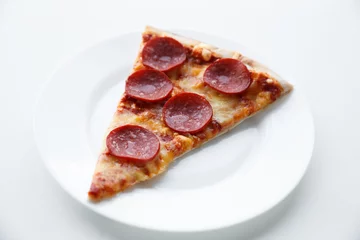 Foto op Plexiglas Pepperoni pizza. Hot homemade food. Slice of fresh italian classic salami pizza. Popular topping with cheese. Baked meal. © tanyastock