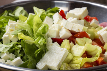 Fresh raw ingredients and romanian cheese telemea for salad