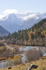 The river flows between the mountains