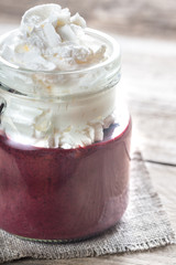 Bilberry smoothie with whipped cream