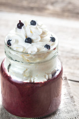 Bilberry smoothie with whipped cream