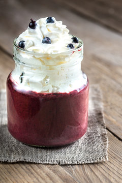 Bilberry smoothie with whipped cream