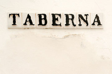 Tavern sign on old Spanish house in downtown Cordoba, Spain

