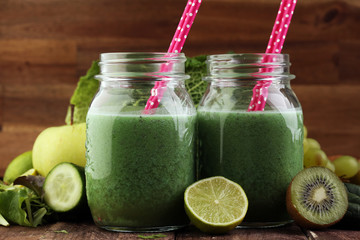 Healthy green smoothie and ingredients - superfoods, detox, diet, health, vegetarian food concept
