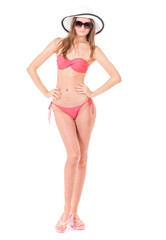 Fototapeta premium Sexy young woman posing in a bikini, isolated on white background 