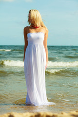 Fototapeta na wymiar Attractive blonde woman on the beach.