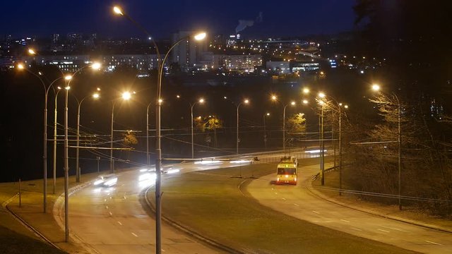 Time lapse, the light trails of city traffic on the building background in Vilnius Lithuania.