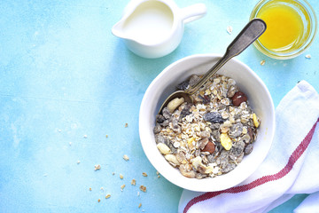 Healthy breakfast - organic muesli and milk.Top view.