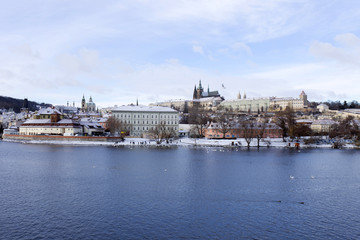 Obraz premium Snowy freeze Prague Lesser Town with gothic Castle, Czech republic