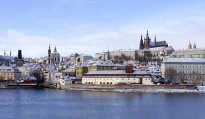 Fototapeta na wymiar Snowy freeze Prague Lesser Town with gothic Castle, Czech republic