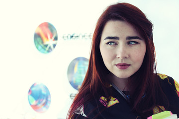 Pretty young girl with long beautiful hair study in university, she is holding books
