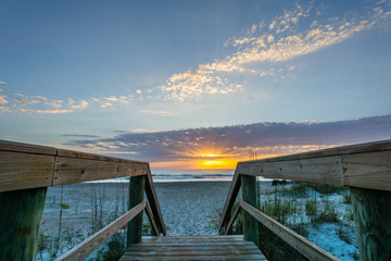 Fototapeta na wymiar Sunrise on the Beach from Walkway