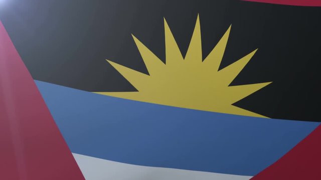 Flag of Antigua and Barbuda waving in the wind, national symbol of freedom