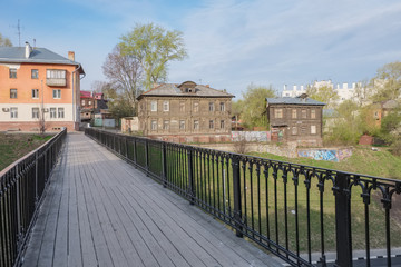 City landscape with a footbridge and old houses. Nizhny Novgorod, Russia