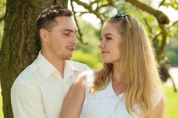 Happy couple having romantic date in park