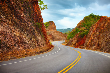 a highway to Samana Peninsula through rocky mountain. Boulevard Turistico Atlantico, 133. Dominican...