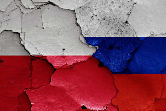 Fototapeta flags of Poland and Russia painted on cracked wall