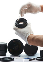 Closeup of hand cleaning lens