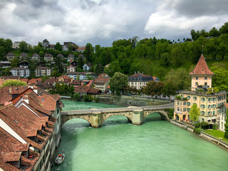 Fototapeta na wymiar Old city of Bern, Switzerland with river Aare on overcast day.