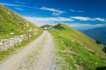 Fototapeta na wymiar Hiking on peaks of Italian mountains with beautiful view to the lake Como