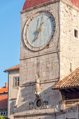 The Clock Tower of the former church of St. Sebastian with the statue of Justice in Trogir, Croatia