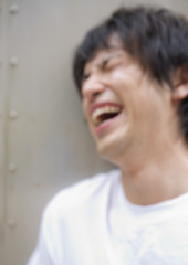 Obraz premium Laughing young man